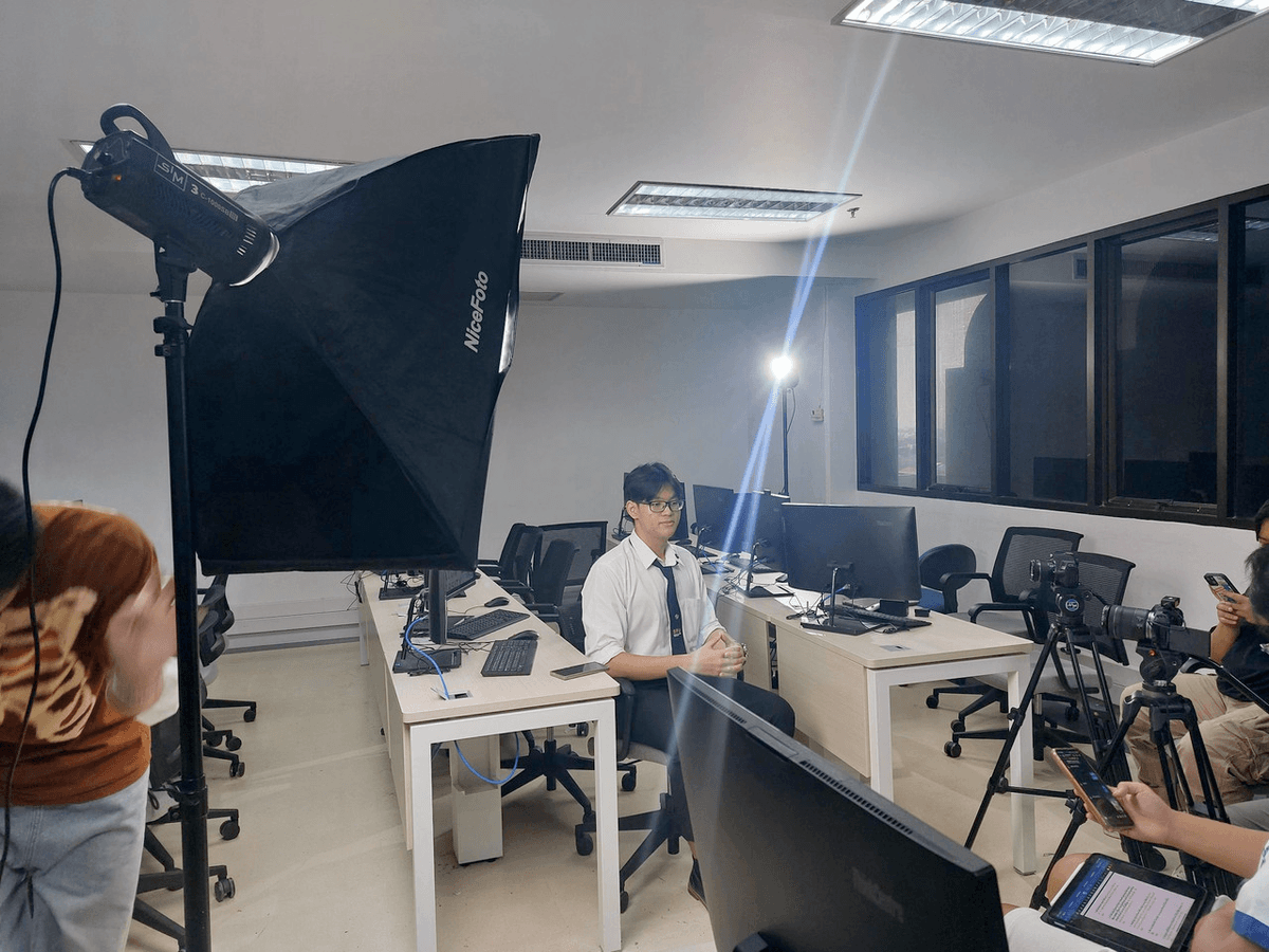 Natthawat with the Sripatum University team at a startup and innovation showcase.